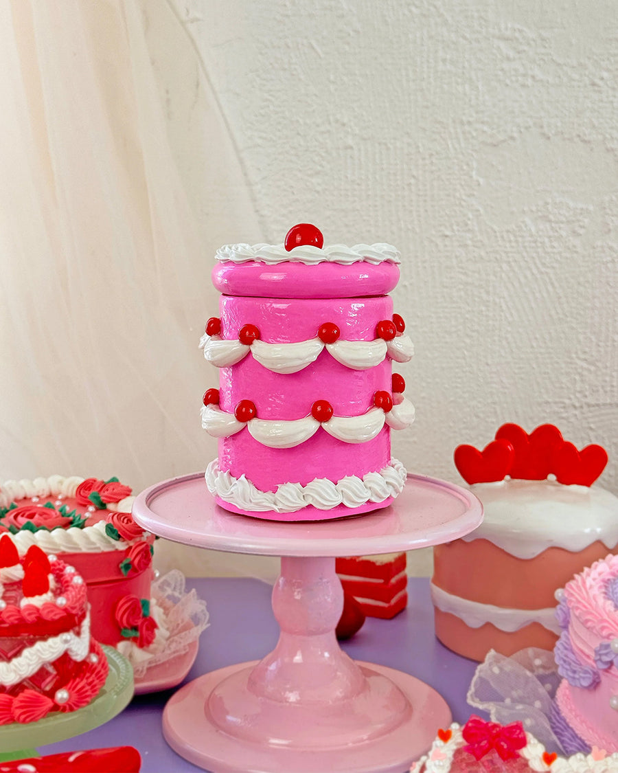 hot pink 'tiered' birthday cake jar with tight seal lid and white frosting and cherry decorations