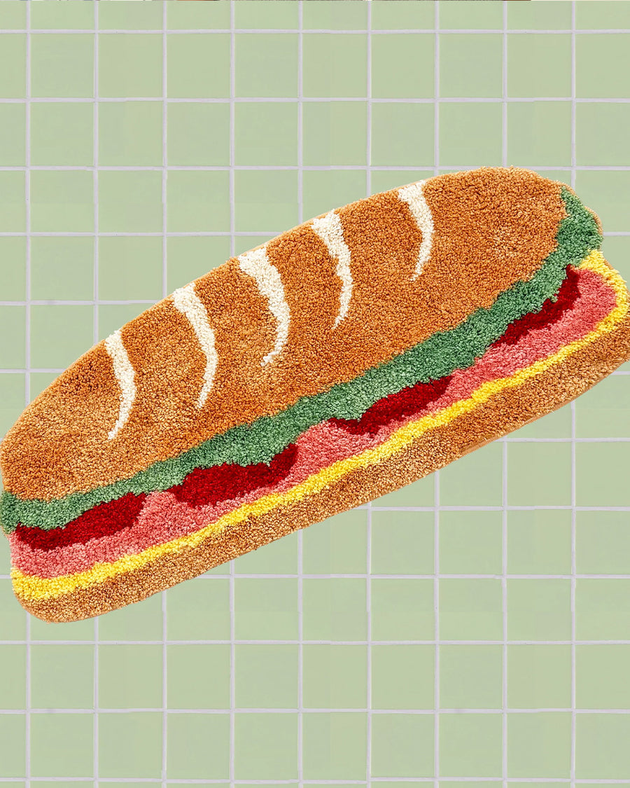 long hoagie shaped throw rug with lettuce, cheese and 'deli meat' center