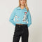 model wearing light blue cropped cardigan with Dalmatian wearing a red beret design wrapping across the side and back