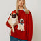 model wearing red oversized crew sweater with pug wearing a blue bow and bandana on the front