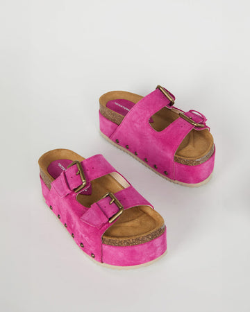 platform suede slide sandals with thick straps and metal buckle closures in fuschia