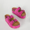 platform suede slide sandals with thick straps and metal buckle closures in fuschia