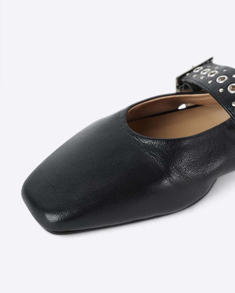 up close of black slingback flat with large grommet buckle and square toe