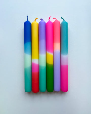 set of six colorful layered tapered candles