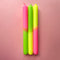 set of 3 pink, lime green and yellow layered taper candles