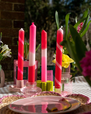 set of 4 scented taper candles with various pink, white and red designs