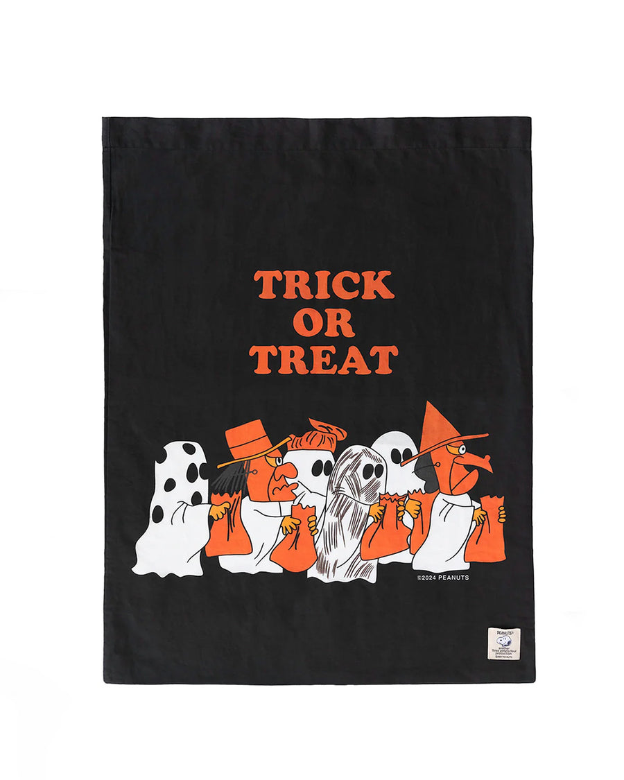 reverse side of black pillowcase style trick or treat bag that has all the peanut characters in costume and says 'TRICK OR TREAT'