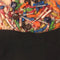 reverse side of black pillowcase style trick or treat bag that has all the peanut characters in costume and says 'TRICK OR TREAT' with candy spilling out