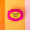 hot pink pill case with yellow 'attention deficit girlie across the front