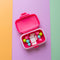 opened hot pink pill case with yellow 'attention deficit girlie across the front