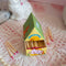 opened drawer on colorful dog house shaped match box with pink tipped matches