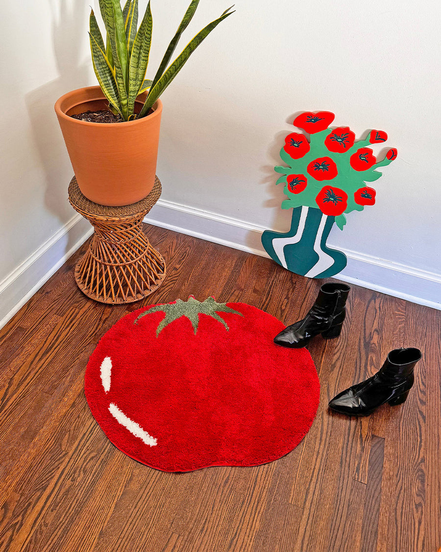 large red beefsteak tomato throw rug in a hallway