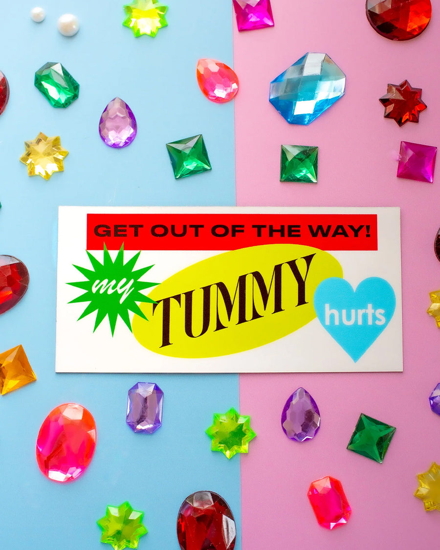 colorful 'get out of my way! my tummy hurts' car magnet surrounded by colorful gems