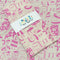 packaged tea towel with pink food face print