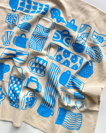 blue 'mug collection' print tea towel