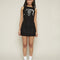 model wearing black knit mini dress with white overlapping faces print on the bust