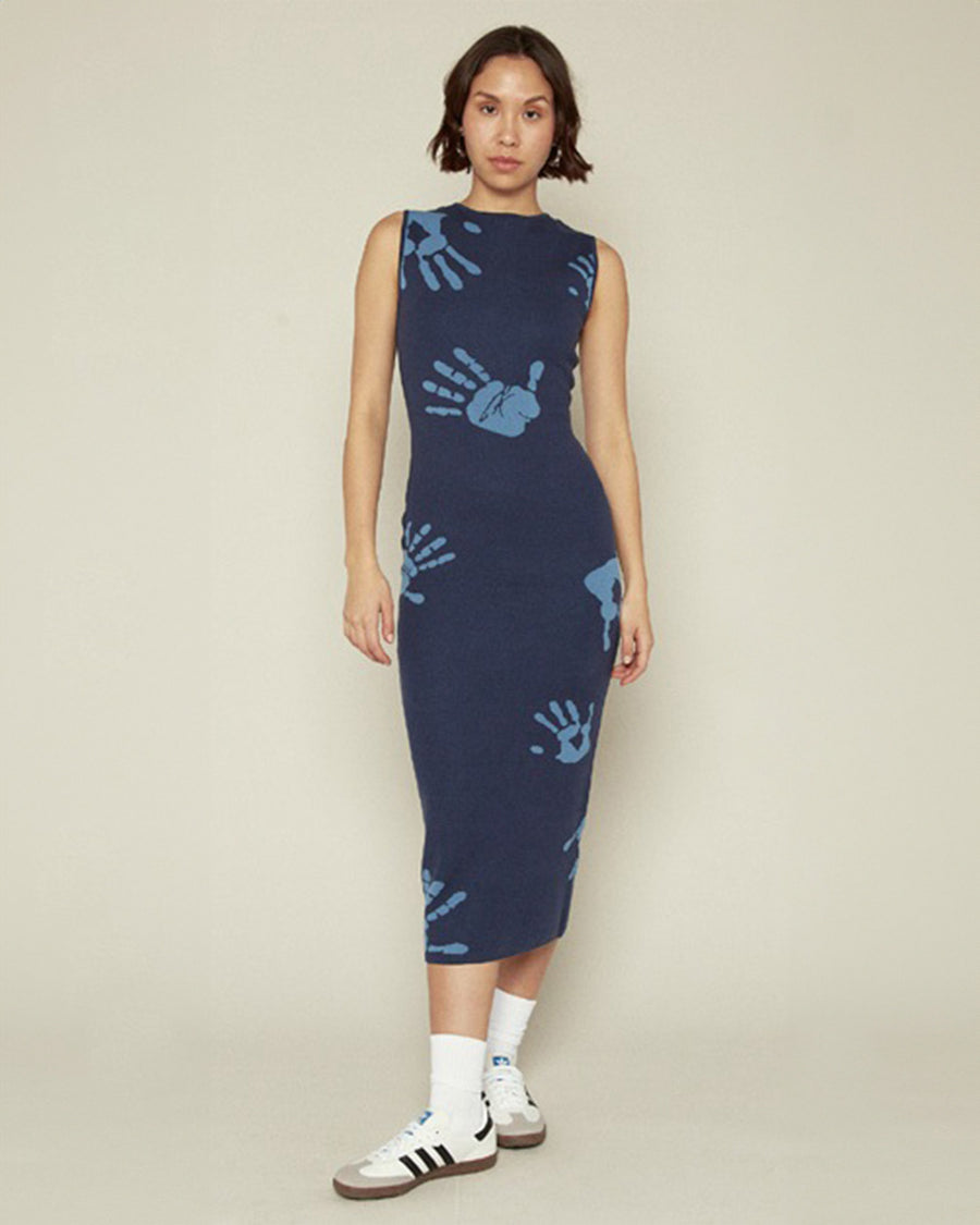 model wearing blue midi dress with all over light blue handprint pattern