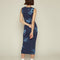 back view of model wearing blue midi dress with all over light blue handprint pattern