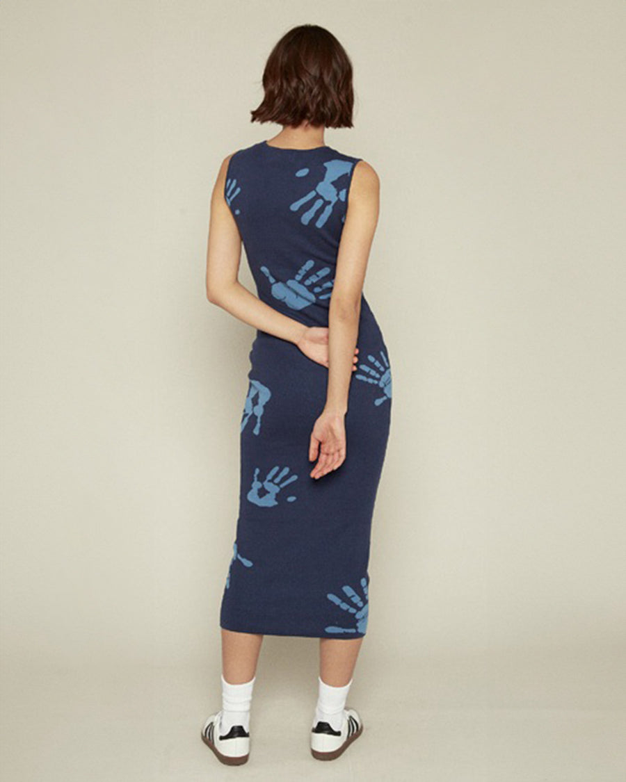 back view of model wearing blue midi dress with all over light blue handprint pattern