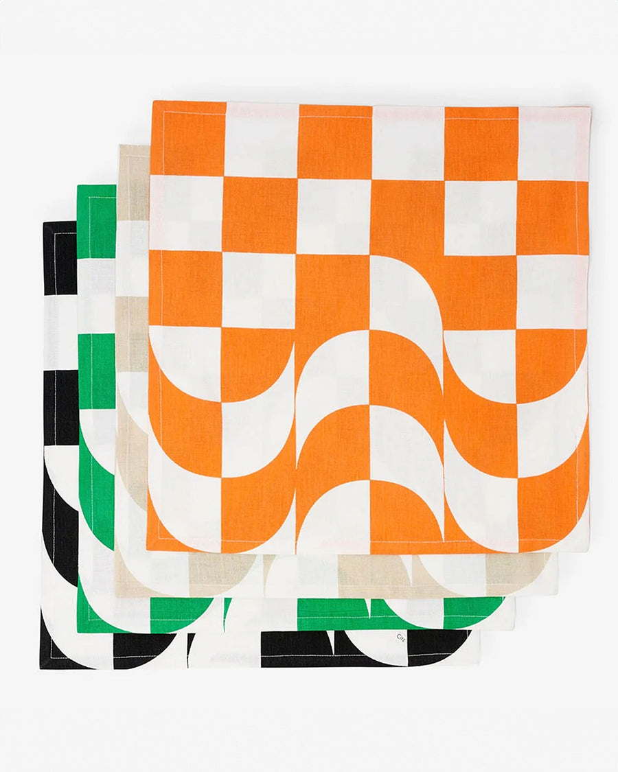 unfolded 4 trippy checker napkins: orange, tan, black and green