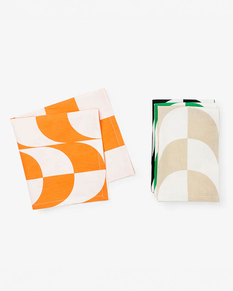 stack of 4 trippy checker napkins: orange, tan, black and green