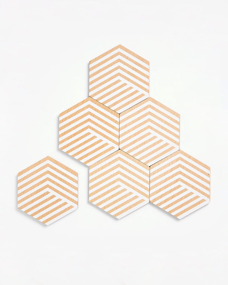 separated set of six cork and white optical coaster set