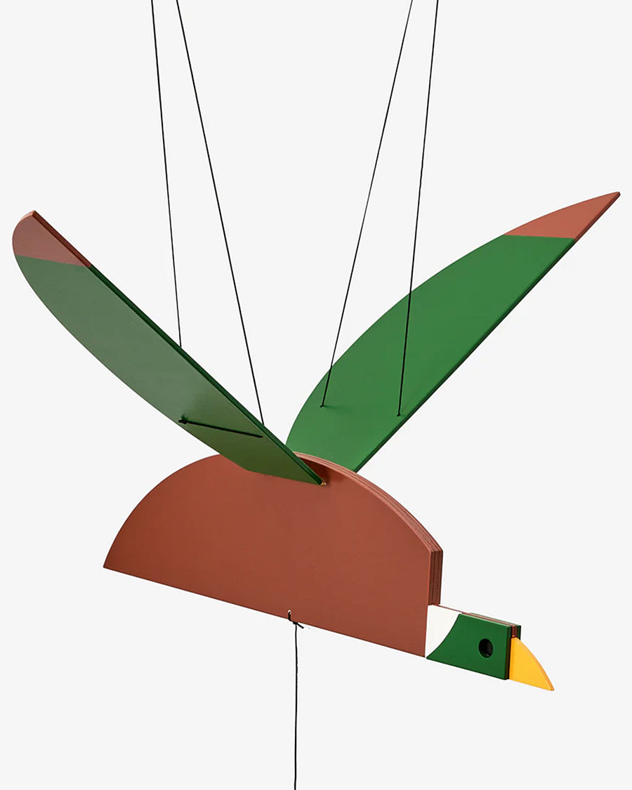 up close of wooden duck mobile with working flapping wings