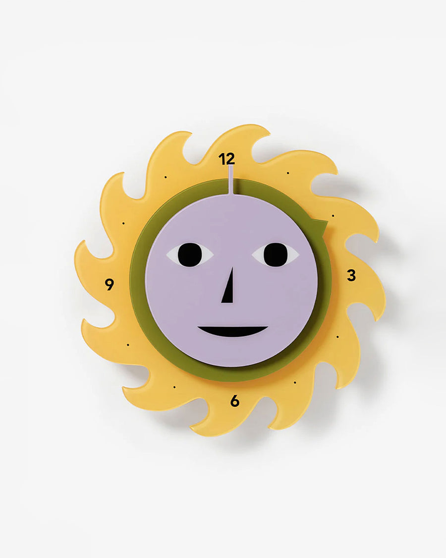 spinning yellow sun wall clock with face