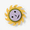 spinning yellow sun wall clock with face in motion