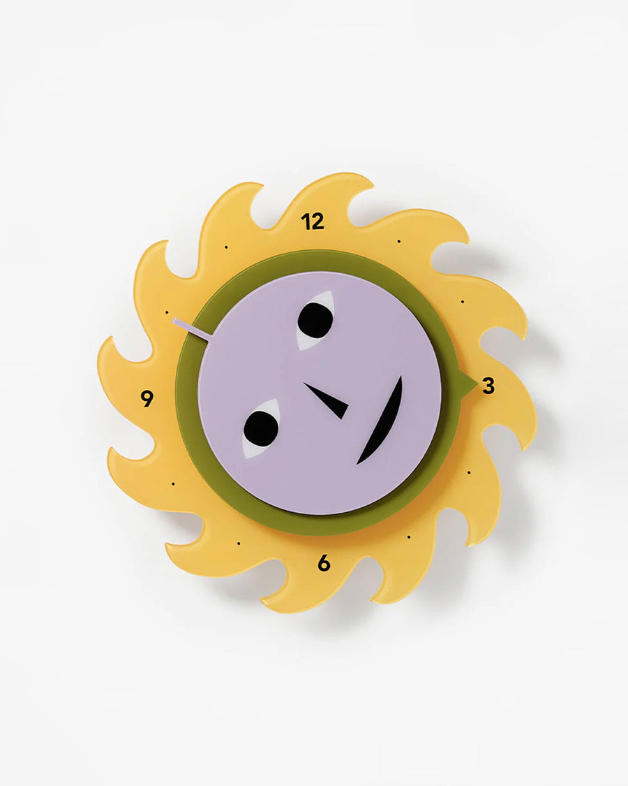 spinning yellow sun wall clock with face in motion