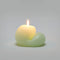 lit light green blob unscented candle