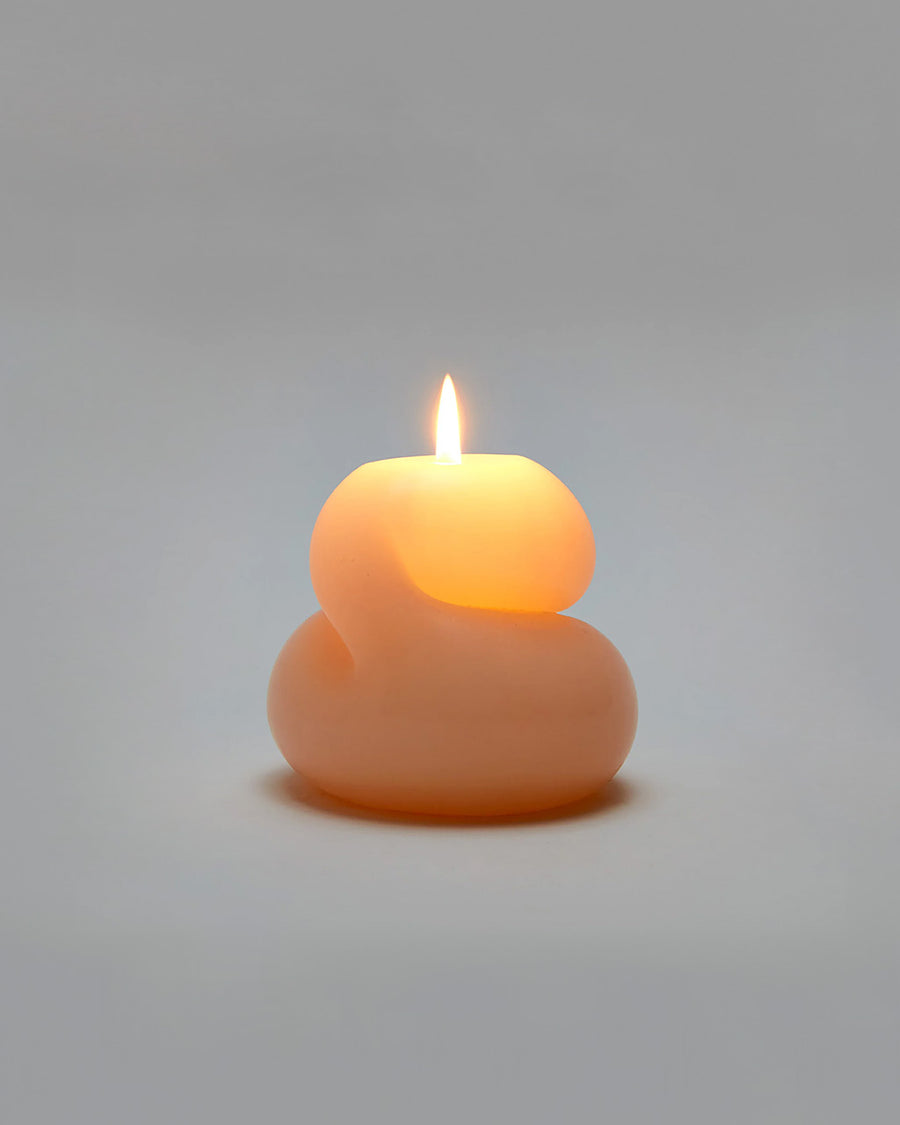 lit light peach blob unscented candle