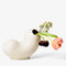 white ceramic curly vase with flower inside