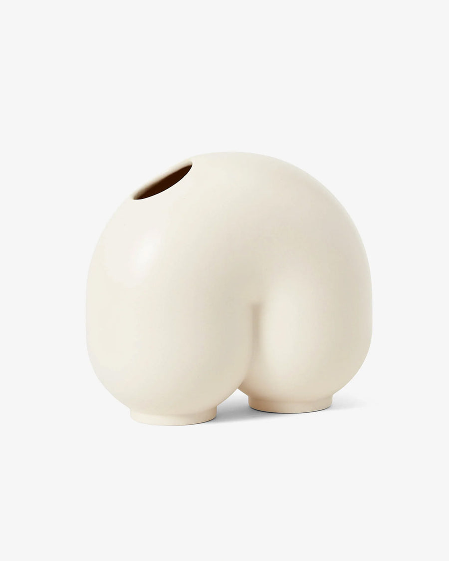 white ceramic vase shaped like a n