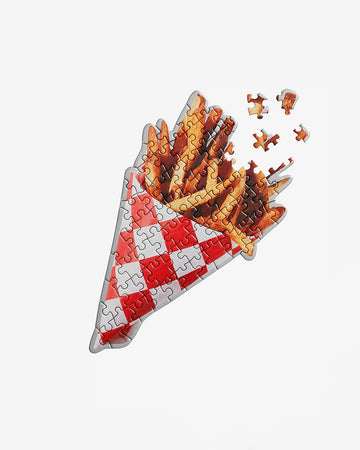 french fry shaped 70 piece puzzle with red and white checkered triangular wrapp