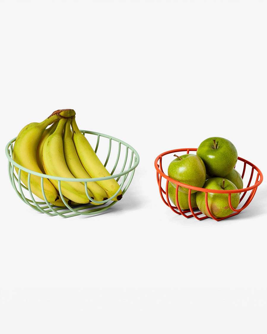 set of two wire baskets: green large and small red with fruit inside