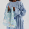 model wearing light blue baby baggu with all over rainbow and cinnamoroll print