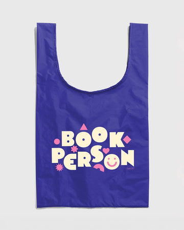 royal blue standard baggu with white 'book person' and pink shapes across the front