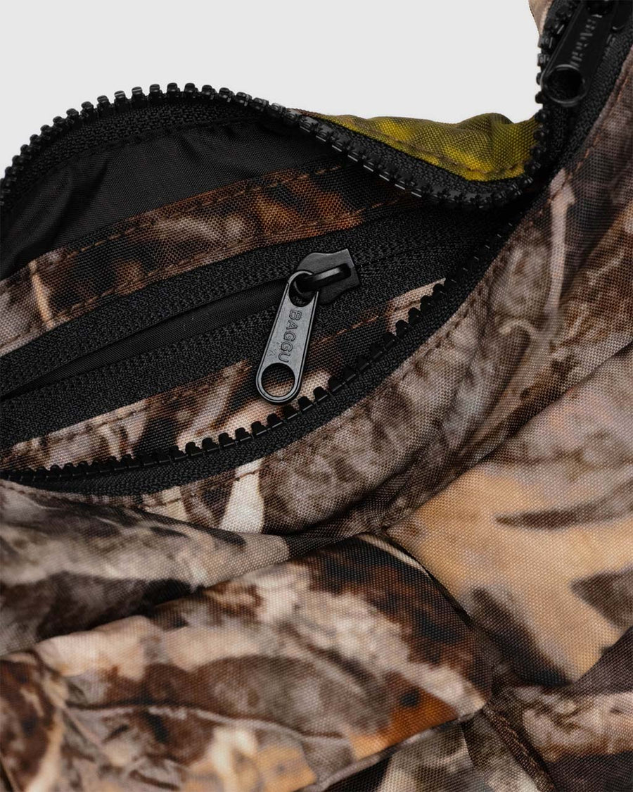 interior pocket of realistic branch and leaf cargo shoulder bag with two front patch pockets in the front