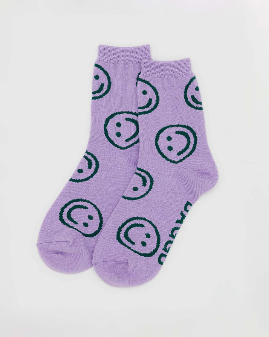 lavender crew socks with all over green smiley print