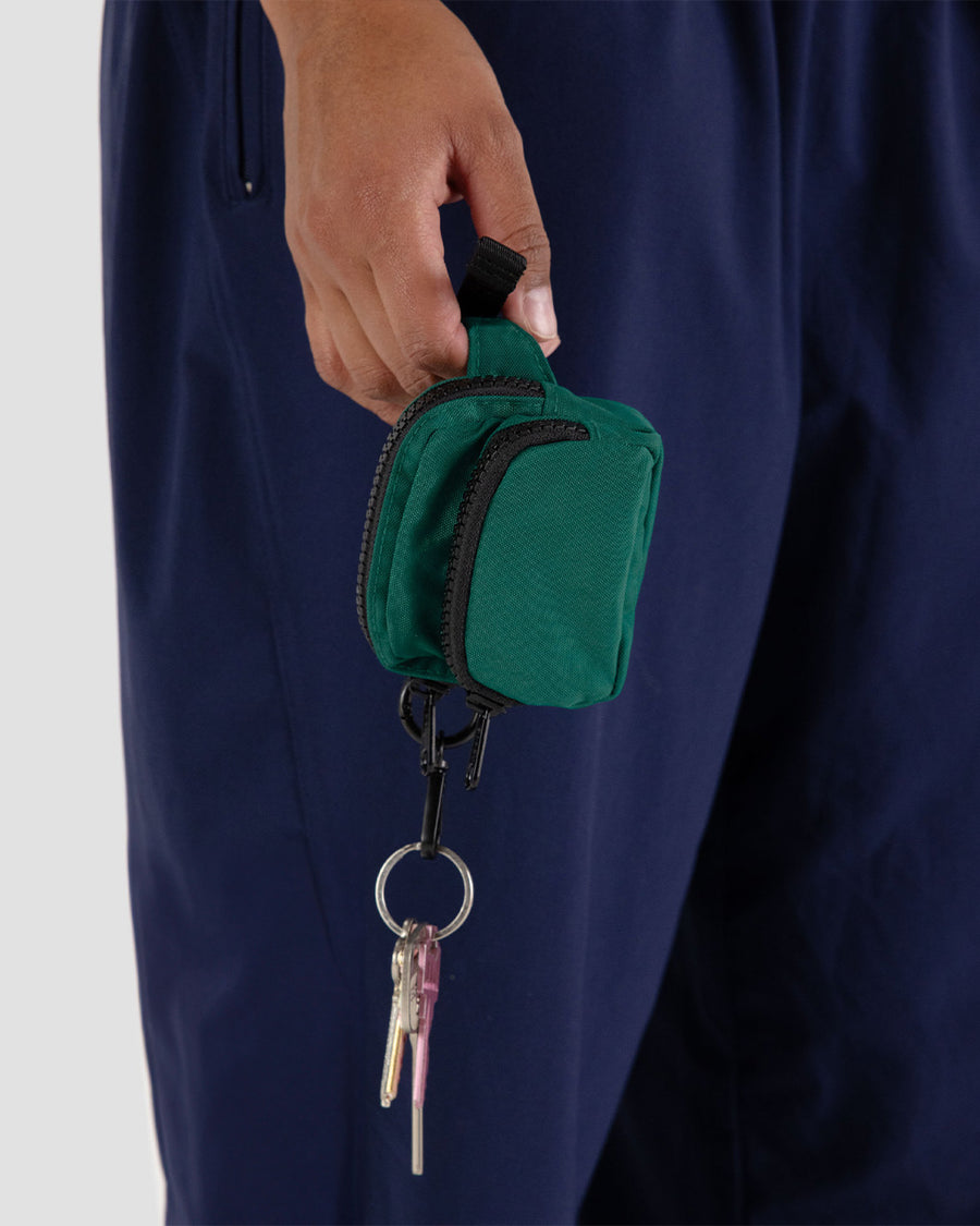 model holding cypress mini baggu fanny pack keychain