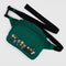 green fanny pack with the peanuts characters across the front