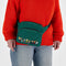 model wearing green fanny pack with the peanuts characters across the front