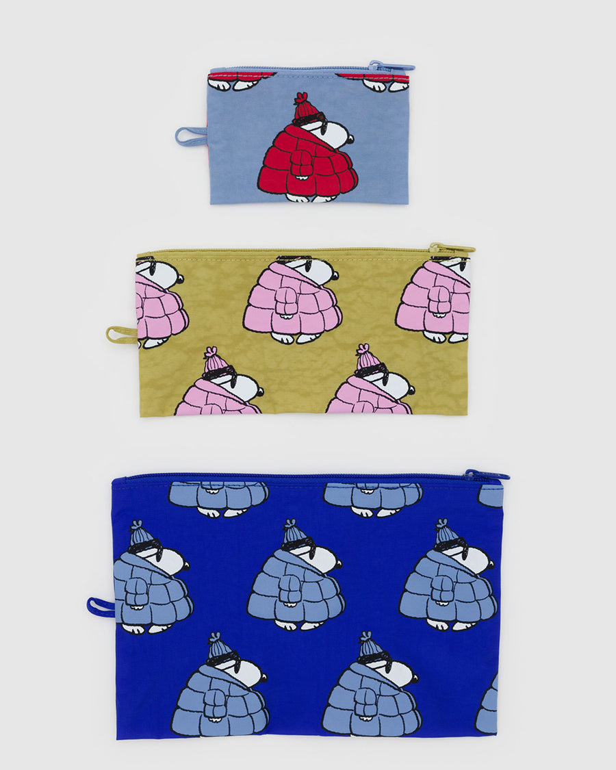 set of three flat pouch set: red snoopy puffer, pink snoopy puffer, and blue snoopy puffer