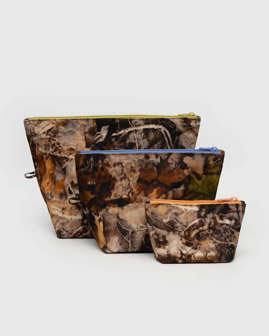 set of three go pouch set with realistic forest print and different color zippers