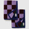 folded set of two double sides hand towels with lavender and brown checker and dark green and navy checkers