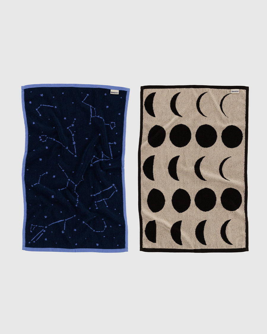 set of two reversible hand towels: navy constellation and cream moon phases