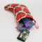 pink strawberry print holiday stocking with items inside