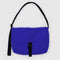 bright blue large messenger bag with black strap and closure 