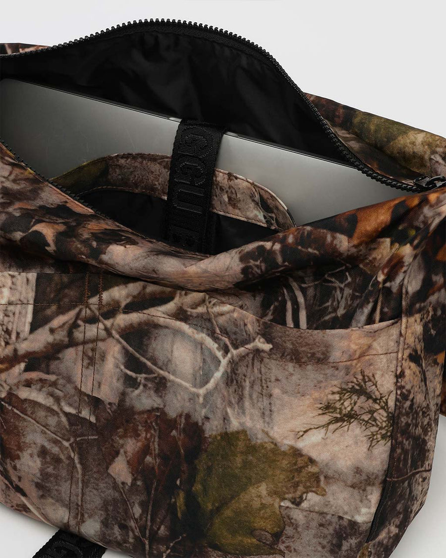 interior of photo forest large messenger bag with black strap and closure 